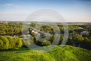 Panoramic view of bridge over river Klyazma in Vladimir city with railroad and green trees photo