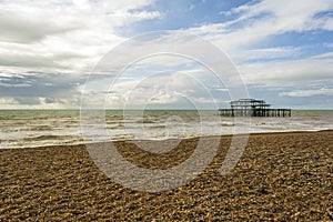 Panoramic view of Brighton`s beach. In the background they are the remains of Brighton West Pier in sea