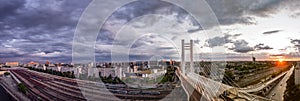 Panoramic view of Bucharest city , modern bridge and railroads in the sunset