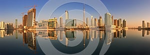 Panoramic view of Business bay and downtown area of Dubai, reflection in a river, UAE