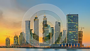 Panoramic view of Business bay and downtown area of Dubai, reflection in a river, UAE