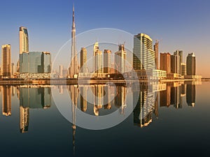 Panoramic view of Business bay and downtown area of Dubai, reflection in a river, UAE