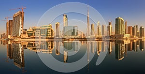 Panoramic view of Business bay and downtown area of Dubai, reflection in a river, UAE