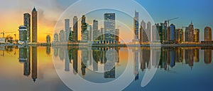 Panoramic view of Business bay and downtown area of Dubai, reflection in a river, UAE