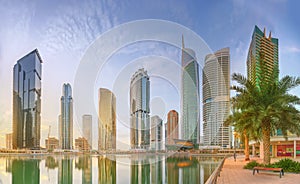 Panoramic view of Business bay and Lake Tower, reflection in a river, Dubai UAE