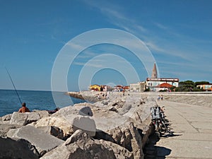 A panoramic view of caorle venice italy city seafront rock promenade