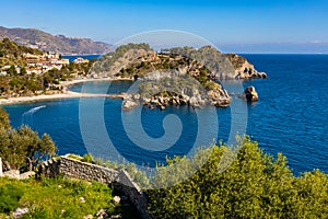 Panoramic view of Capo Taormina cape with Isola Bella island on Ionian sea shore in Messina region of Sicily in Italy