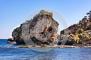 Panoramic view of Capo Taormina cape with Isola Bella island on Ionian sea shore in Messina region of Sicily in Italy