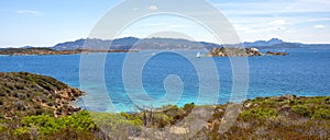 Panoramic view of Caprera Island and Spiaggia di Cala Portese harbor at the Tyrrhenian Sea coastline with Isola Porco island, La