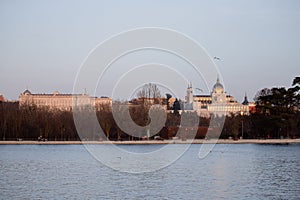 Panoramic view of the Casa de Campo lake in Madrid with the Almudena Cathedral and the royal palace in the background