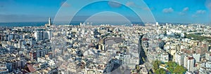 Panoramic view of Casablanca cityscape under cloudy sky in Morocco