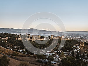 Panoramic view of the castle Alhambra in Granada, Andalusia, Spain, during sunset, from the Mirador de la Cruz de Rauda