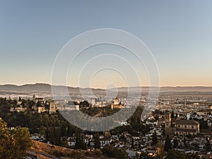 Panoramic view of the castle Alhambra in Granada, Andalusia, Spain, during sunset, from the Mirador de la Cruz de Rauda