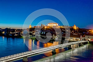 Panoramic view of Castle on top of hill at night, aerial view of Ptuj, Slovenia in dusk