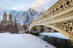 Panoramic view of Central Park Bow bridge and Upper West side in winter