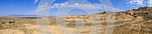 Panoramic view of Charyn national park in Kazakhstan. Clouds background. Beautiful sand stone formations. Soil errosion.