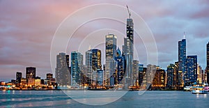 Panoramic view of Chicago city high rise buildings cloudy sky in the evening