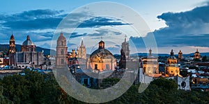 Panoramic view of church domes of San Miguel de Allende, Mexico in twilight