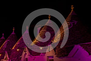 Panoramic view of the City of Alberobello with ancient traditional Italian Bluildings called Trulli at night