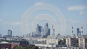 Panoramic view of city and blue skyscrapers. Action. Simple view of city on background of high-rise buildings in Moscow