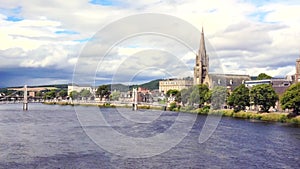 Panoramic view of the city of Inverness on the Isle of Skye, Scotland, on a cloudy and clear summer day