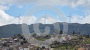 Panoramic view of the city of Loja  with wind turbines on the horizon photo