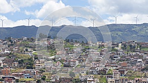 Panoramic view of the city of Loja in Ecuador with wind turbines on the horizon photo