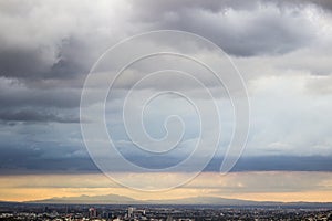 Panoramic view of the city of Monterrey, Nuevo LeÃ³n in MÃ©xico, its mountains and the clouds.