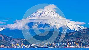 Panoramic view of the city Petropavlovsk-Kamchatsky and volcanoes: Koryaksky Volcano, Avacha Volcano, Kozelsky Volcano. Russian