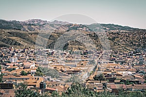 Panoramic view of city of Sucre in Bolivia, with colonial style buildings and mountains in the background