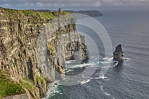 Panoramic view of the Cliffs of Moher, Ireland. Cliffs of Moher during sunset. Coastline in Ireland with huge cliffs