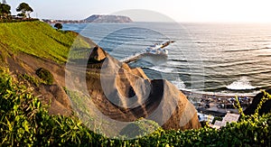 Panoramic view of the coast shore cliff called `costa verde` from the Miraflores Pier in Lima, Peru