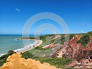 Panoramic view of the coastal cliff with red rocks