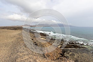 Panoramic view at the coastline in the natural park of Jandia Parque Natural De Jandina on canary island Fuerteventura with photo