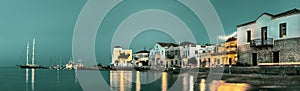 Panoramic view of the coastline and old buildings at evening, Spetses, Greece.