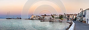 Panoramic view of the coastline, taverns, restaurants and old buildings in Spetses, Greece.