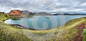 Panoramic view of colorful rhyolite volcanic mountains Landmannalaugar and Frostastadavatn Highland lake as pure wilderness in