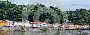 Panoramic view of colorful row of houses at river Danube, Passau, Bavaria, Germany