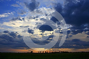 Panoramic view of colorful sunset over wetlands and meadows wildlife refuge by the Biebrza river in Poland