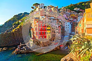 Panoramic view of colorful Village Riomaggiore in Cinque Terre during sunset, Liguria, Italy