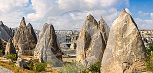 Panoramic view of cone-shaped rock formations in Goreme, Turkey