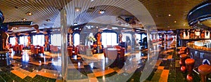 Panoramic view of a cruise ship\'s luxurious lounge with ornate decor and reflective marble floors