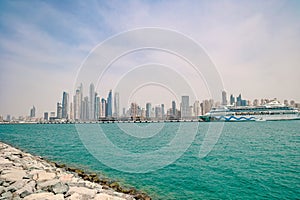 Panoramic view of the cruise ships and skyscrapers at the dubai