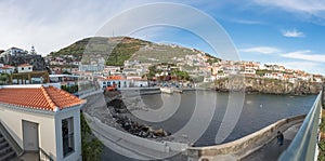 Panoramic view CÃ¢mara do Lobos bay and harbour, a small touristic fisherman\'s village photo