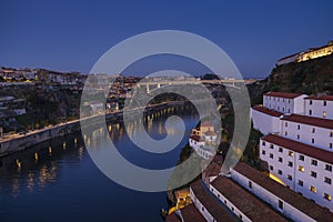 Panoramic view of Douro river and Infante D Henrique bridge at night, Porto, Portugal photo