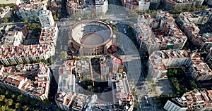 Panoramic view from drone of Barcelona bullring La Monumental and Eixample district