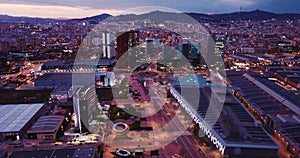 Panoramic view from drone of night Barcelona. Plaza de Europa with Fira Barcelona Gran Via conference center