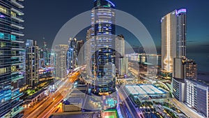 Panoramic view of the Dubai Marina and JBR area and the famous Ferris Wheel aerial day to night timelapse