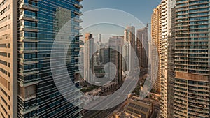 Panoramic view of the Dubai Marina and JBR area and the famous Ferris Wheel aerial morning timelapse