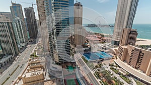 Panoramic view of the Dubai Marina and JBR area and the famous Ferris Wheel aerial timelapse